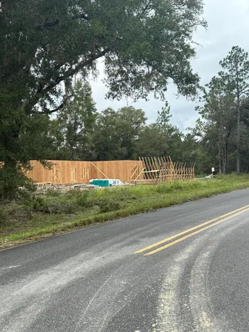 a view of a road with a yard