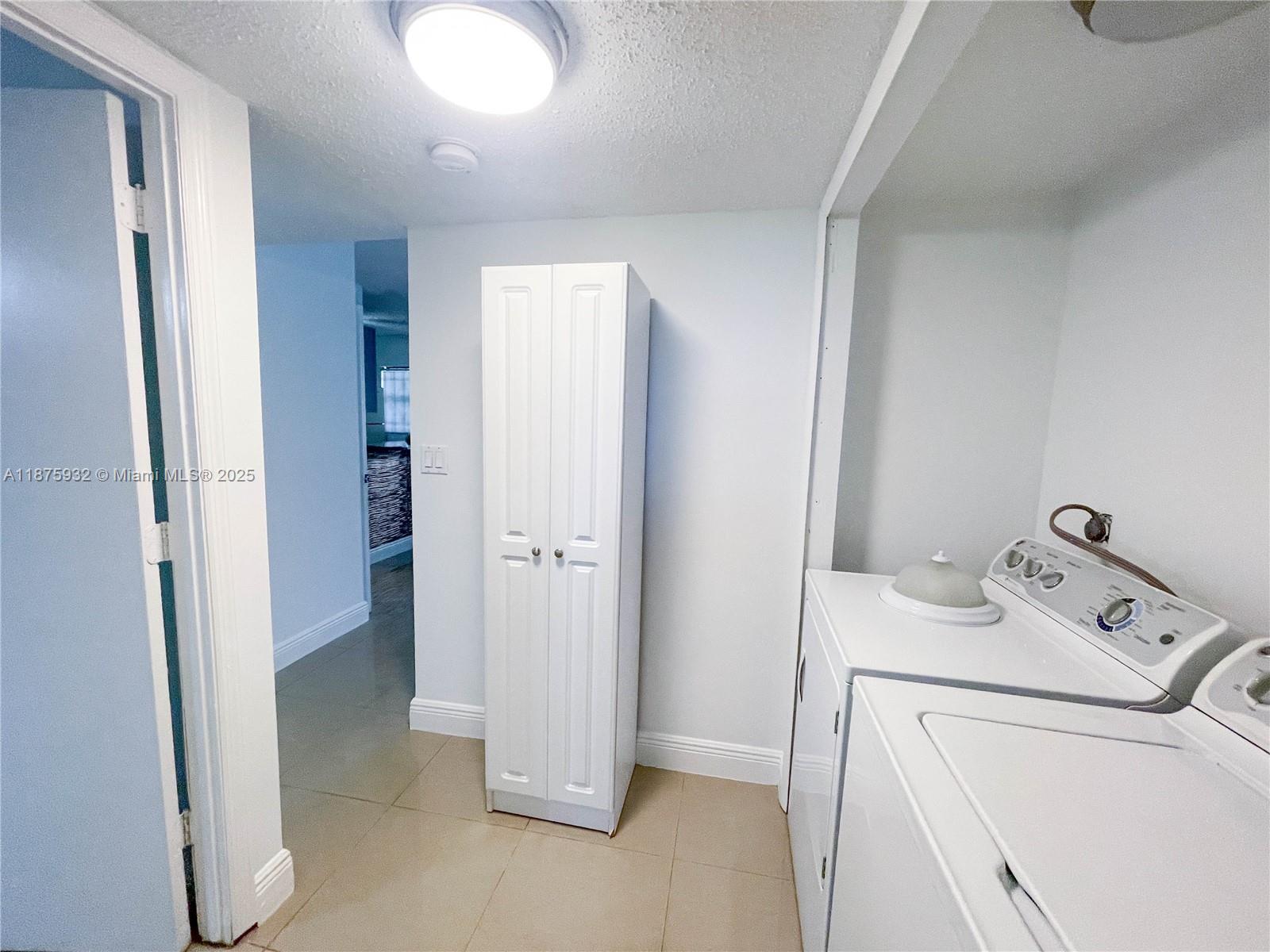 10370 Southwest 220th Street, Unit 129 Miami, FL 33190 - Photo 7 of 8 a view of a storage & utility room with a sink