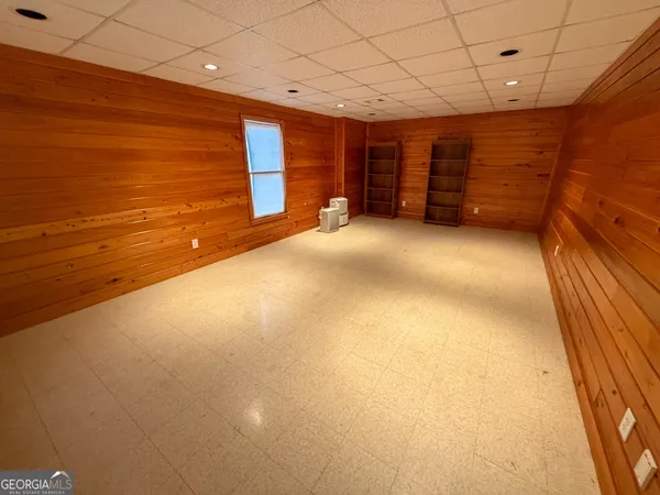 a room with cabinets and dust bin