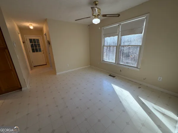 a view of an empty room with a window