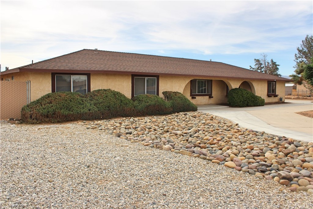 15545 Erie Road Apple Valley, CA 92307 - Photo 1 of 1 a house that has a lot of windows in it