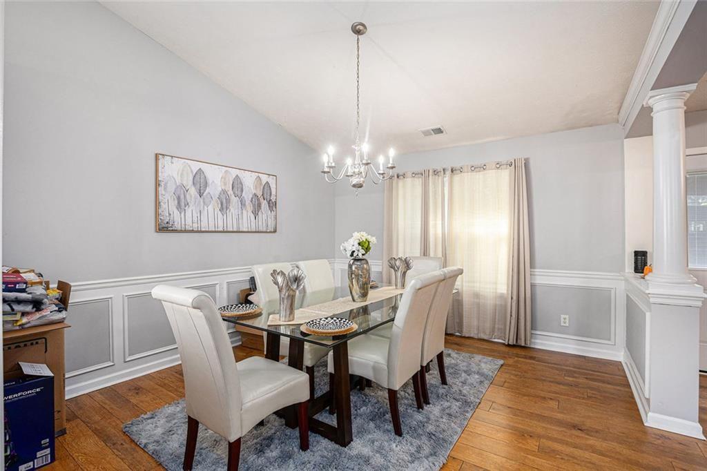 615 Hemlock Court Villa Rica, GA 30180 - Photo 11 of 31 a view of a dining room with furniture window and wooden floor