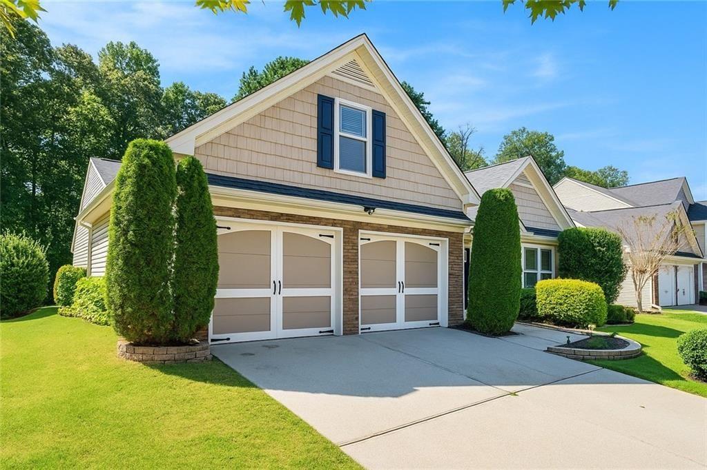 615 Hemlock Court Villa Rica, GA 30180 - Photo 2 of 31 a view of a house with backyard and a garage