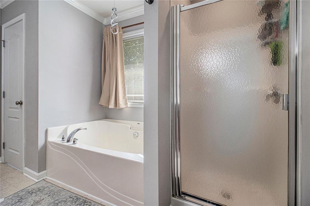 615 Hemlock Court Villa Rica, GA 30180 - Photo 23 of 31 a white bath tub sitting next to a shower