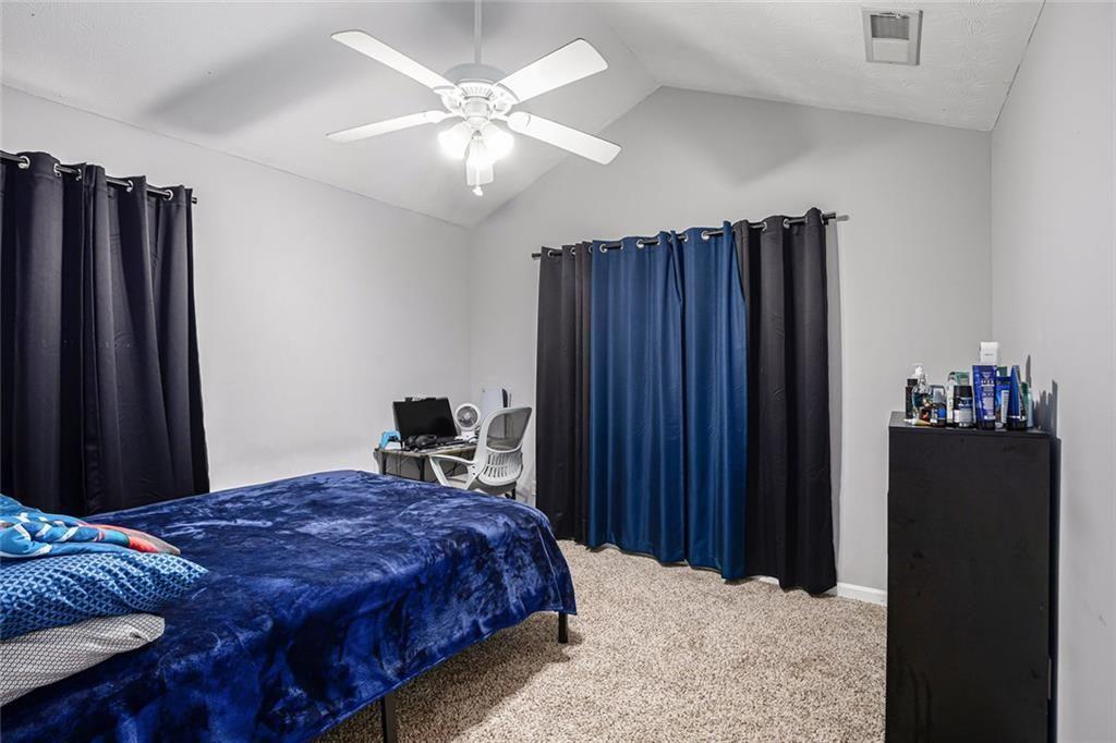 615 Hemlock Court Villa Rica, GA 30180 - Photo 24 of 31 a bedroom with a bed and a closet