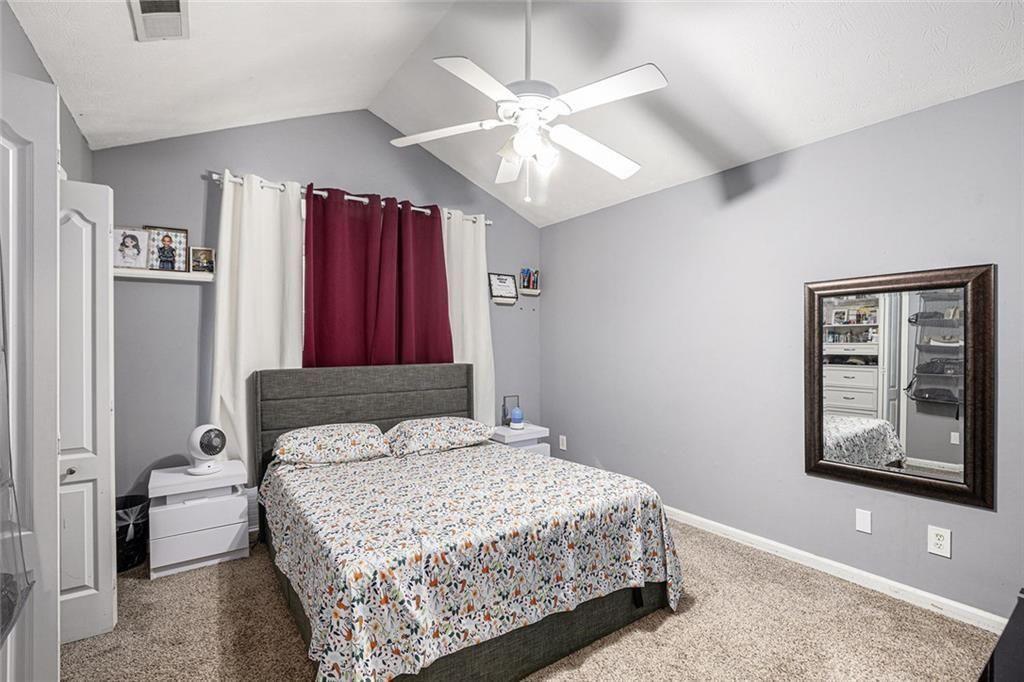 615 Hemlock Court Villa Rica, GA 30180 - Photo 25 of 31 a bedroom with a large bed and a window