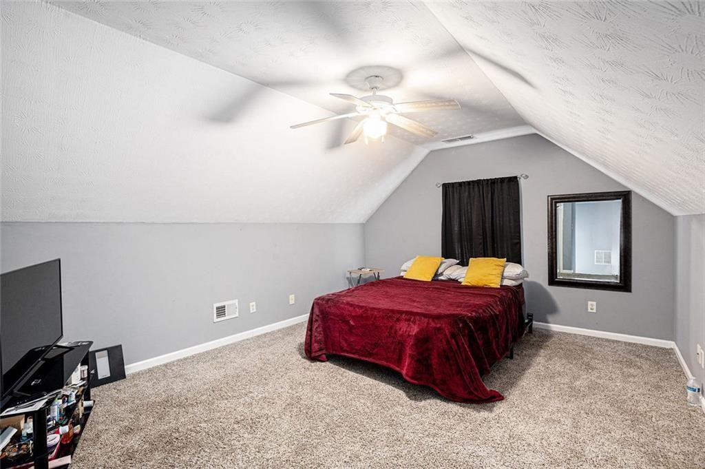 615 Hemlock Court Villa Rica, GA 30180 - Photo 26 of 31 a bed room with a bed and a window