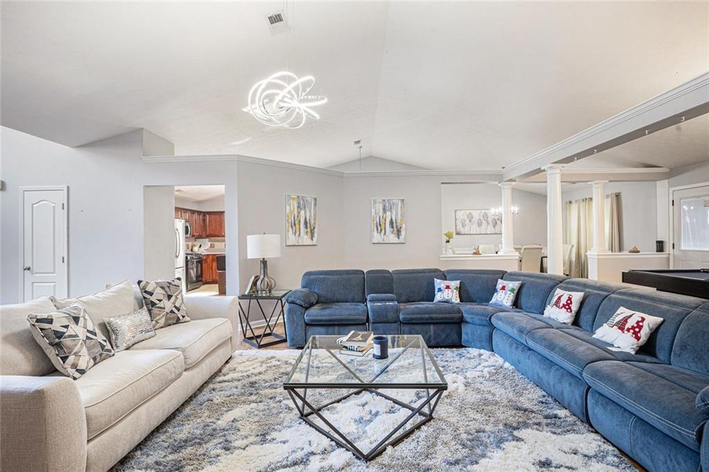 615 Hemlock Court Villa Rica, GA 30180 - Photo 6 of 31 a living room with furniture a rug and a window