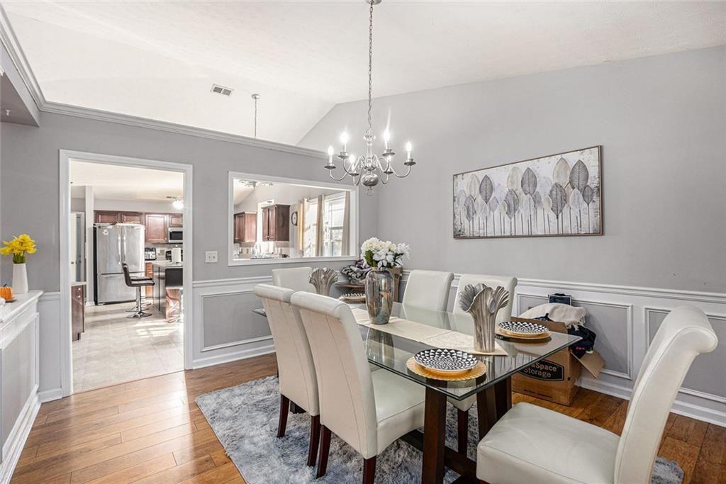 615 Hemlock Court Villa Rica, GA 30180 - Photo 10 of 31 a view of a dining room with furniture and chandelier