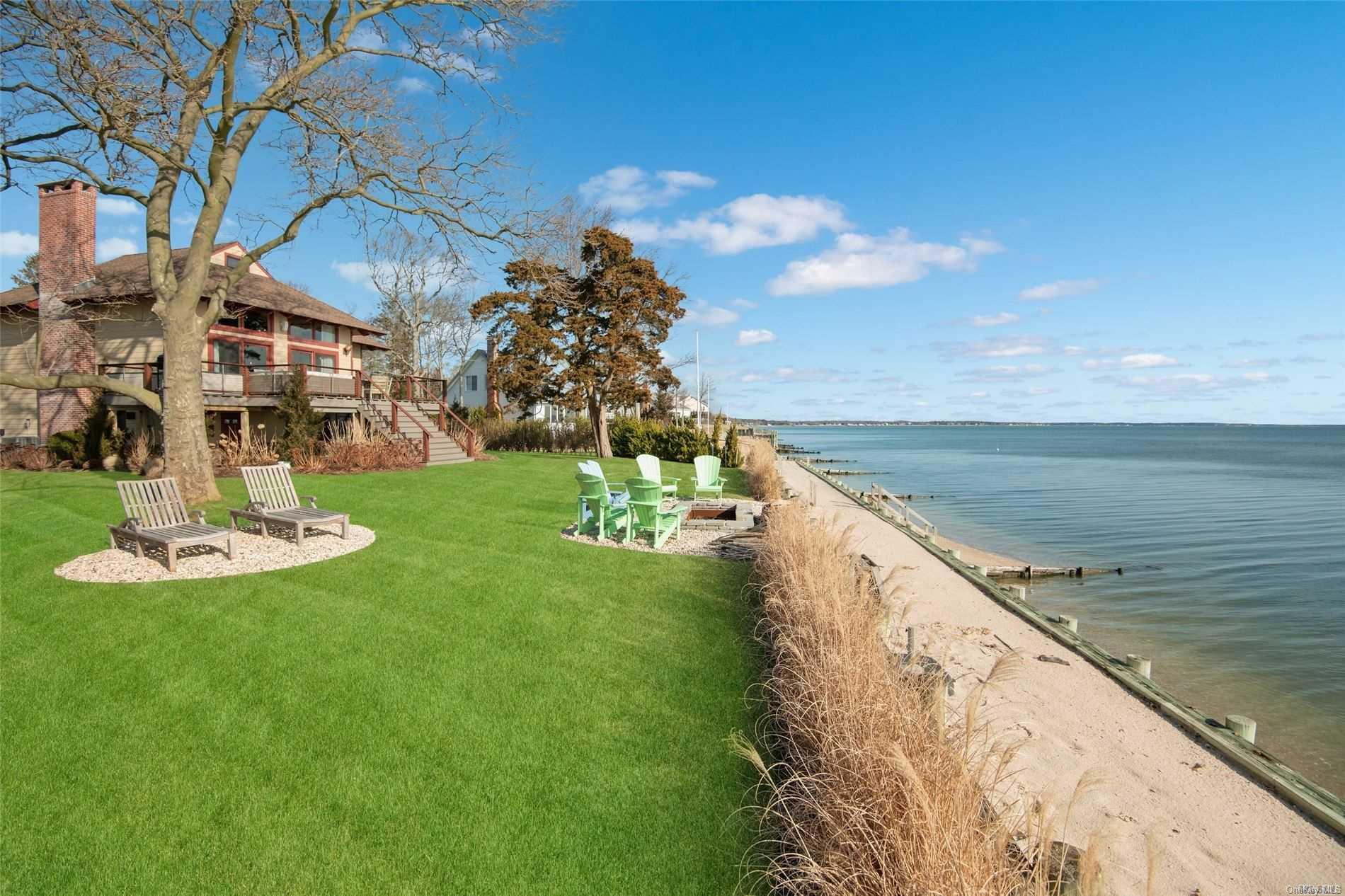 2826 Peconic Bay Boulevard Laurel, NY 11948 - Photo 1 of 1 a view of a lake with a yard