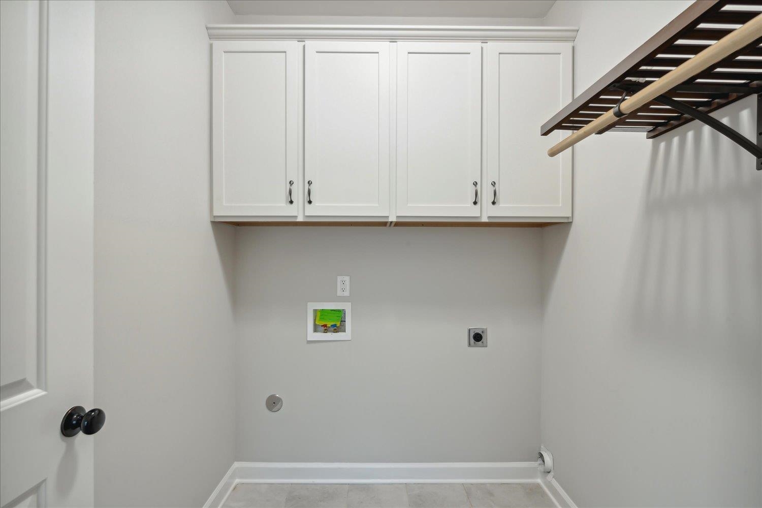 6437 Rutherford Circle Arlington, TN 38002 - Photo 18 of 40 Clothes washing area with washer hookup, light tile patterned floors, and hookup for an electric dryer