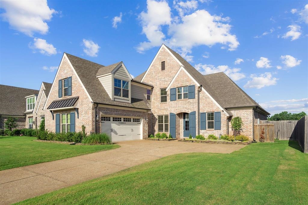 6437 Rutherford Circle Arlington, TN 38002 - Photo 2 of 40 View of front of house featuring a front lawn and a garage