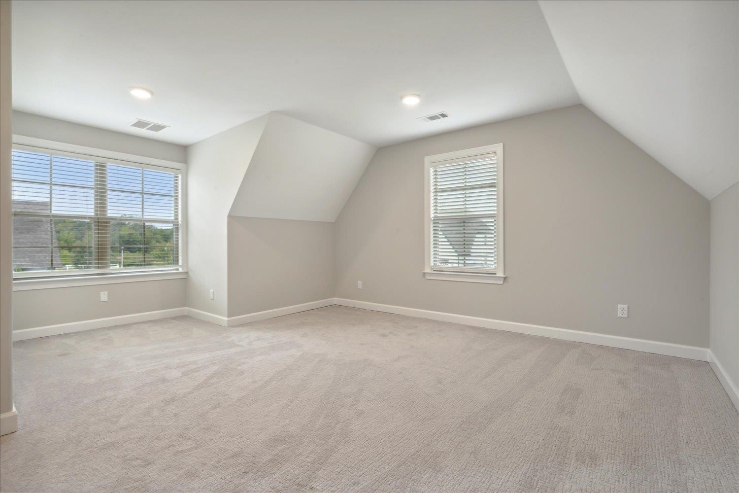 6437 Rutherford Circle Arlington, TN 38002 - Photo 28 of 40 Bonus room featuring light colored carpet and vaulted ceiling