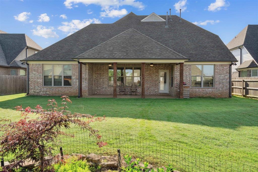 6437 Rutherford Circle Arlington, TN 38002 - Photo 36 of 40 Back of property featuring a patio area and a lawn
