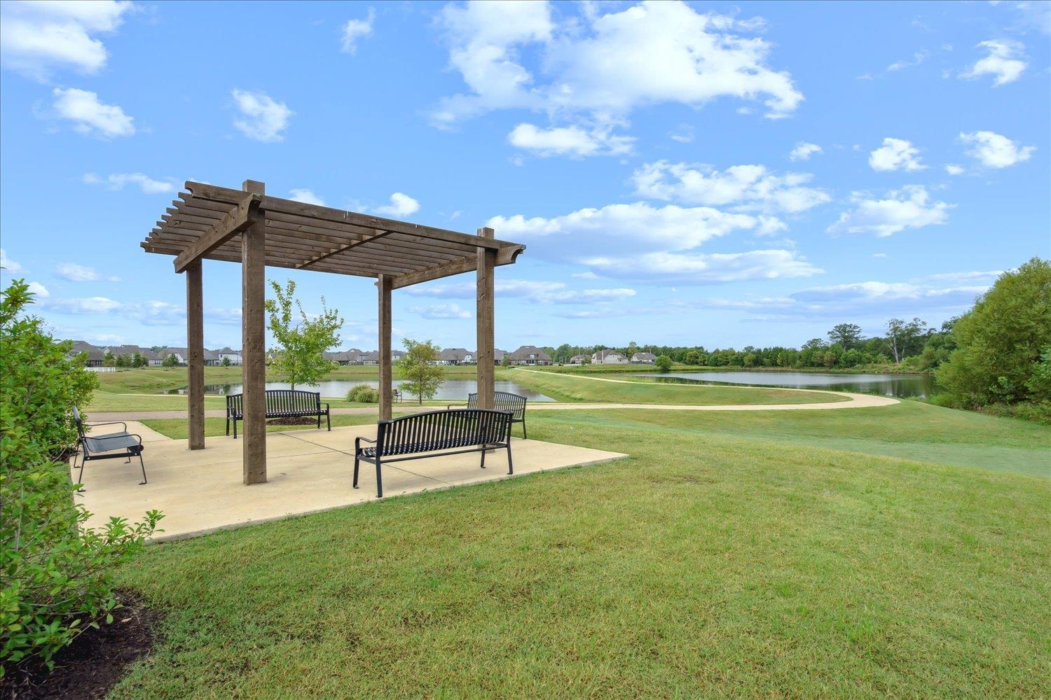 6437 Rutherford Circle Arlington, TN 38002 - Photo 37 of 40 View of community featuring a water view, a lawn, and a pergola