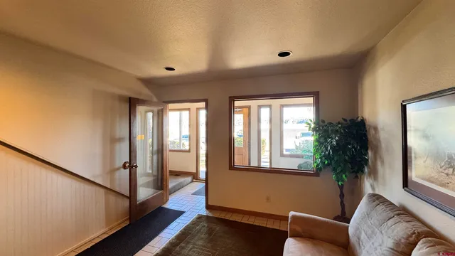 a living room with furniture and a rug