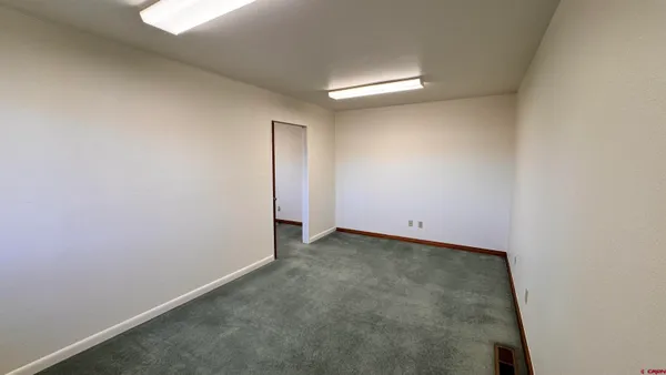 an empty room with a empty space and window