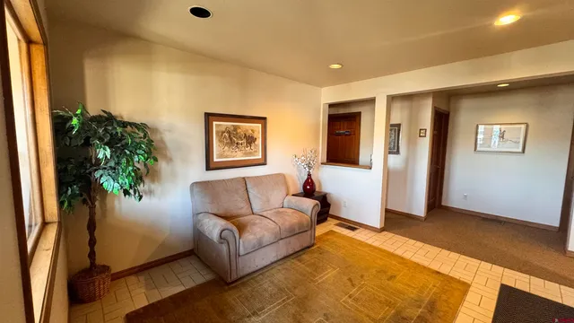 a living room with furniture and a window