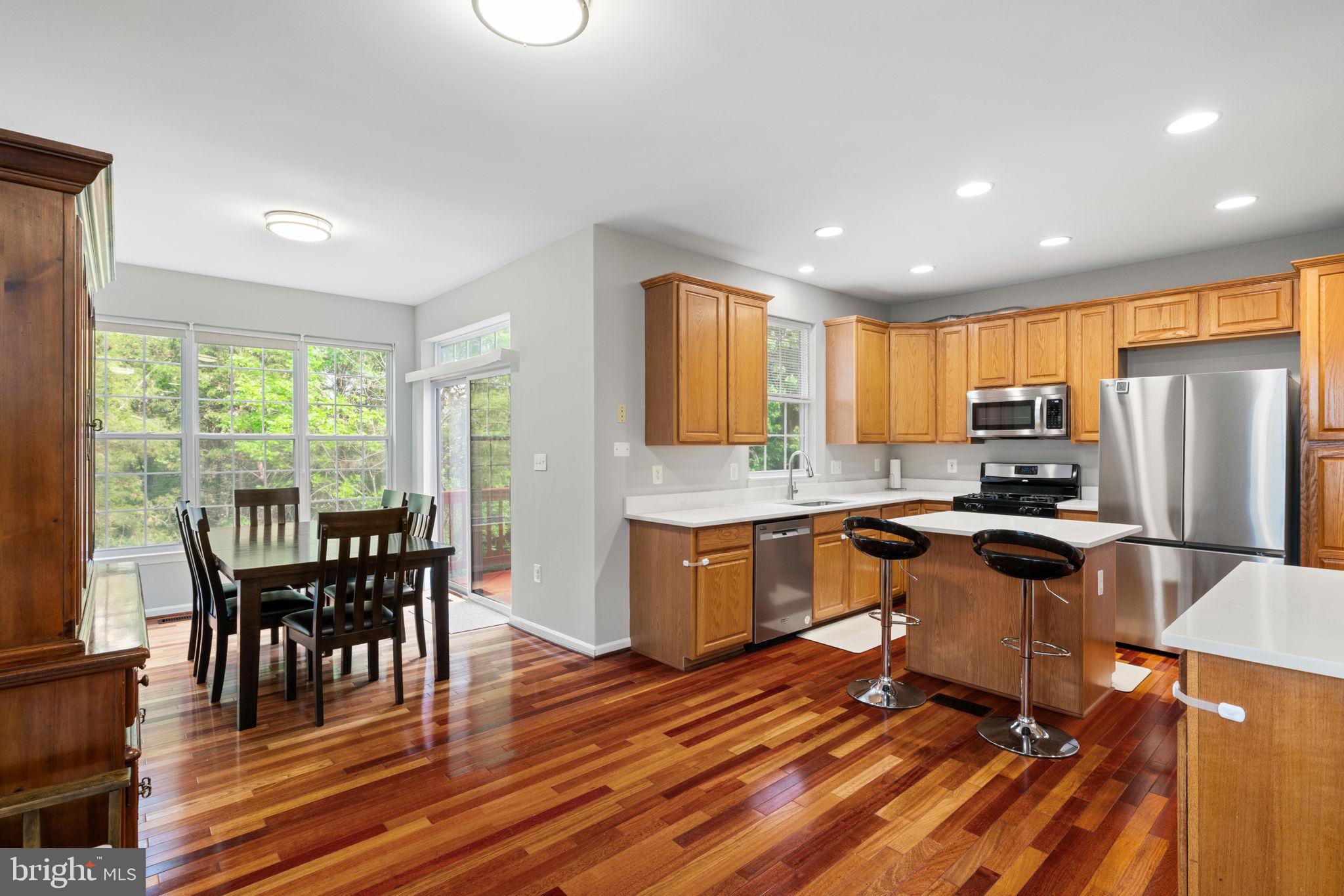 21654 Frame Square Broadlands, VA 20148 - Photo 15 of 43 Modern kitchen with warm wood tones.