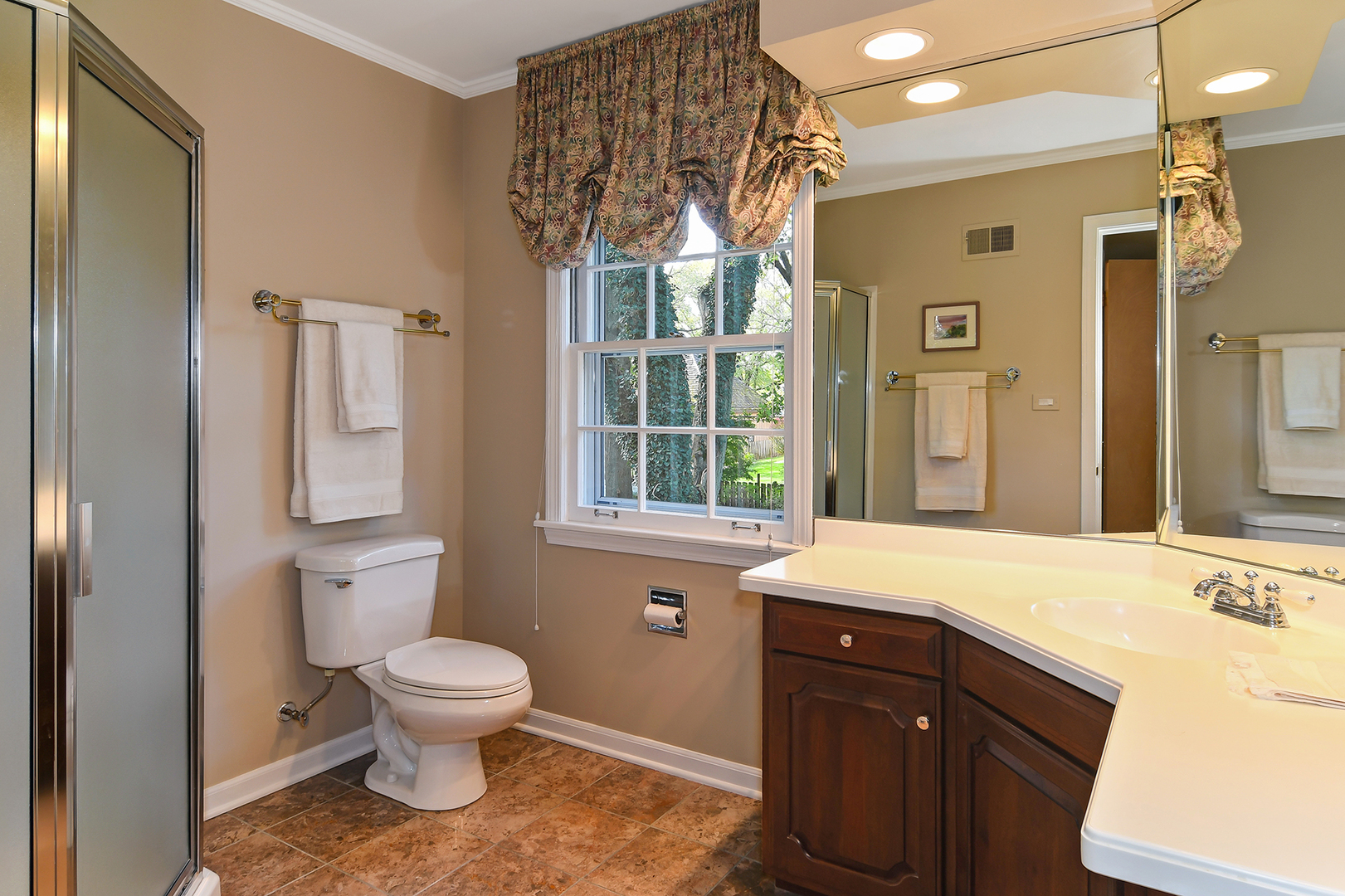 1124 Woodview Road Burr Ridge, IL 60527 - Photo 18 of 27 a spacious bathroom with a sink toilet and shower