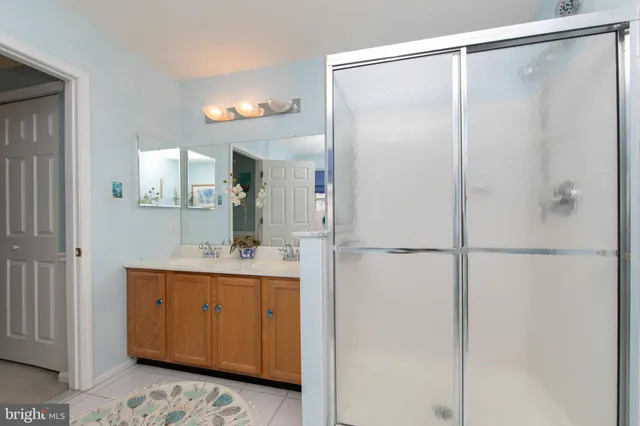 a bedroom with a bed a couch and a window