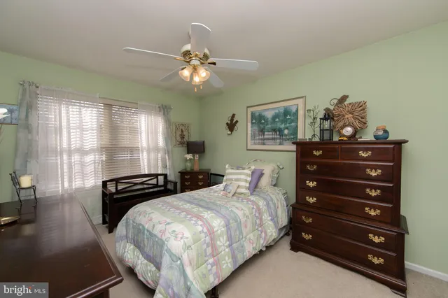 a bedroom with a bed and a closet