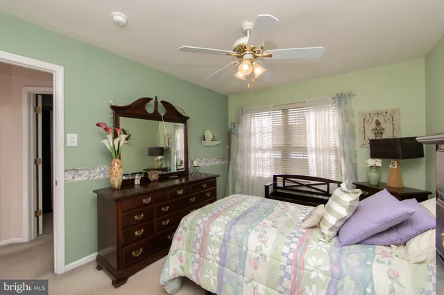 a bedroom with a bed and dresser