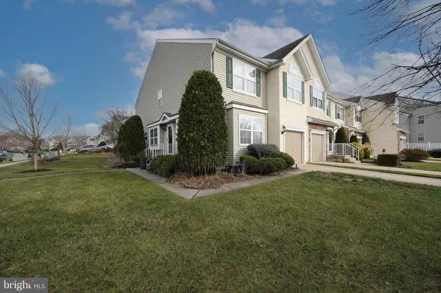 a backyard of a house with outdoor seating