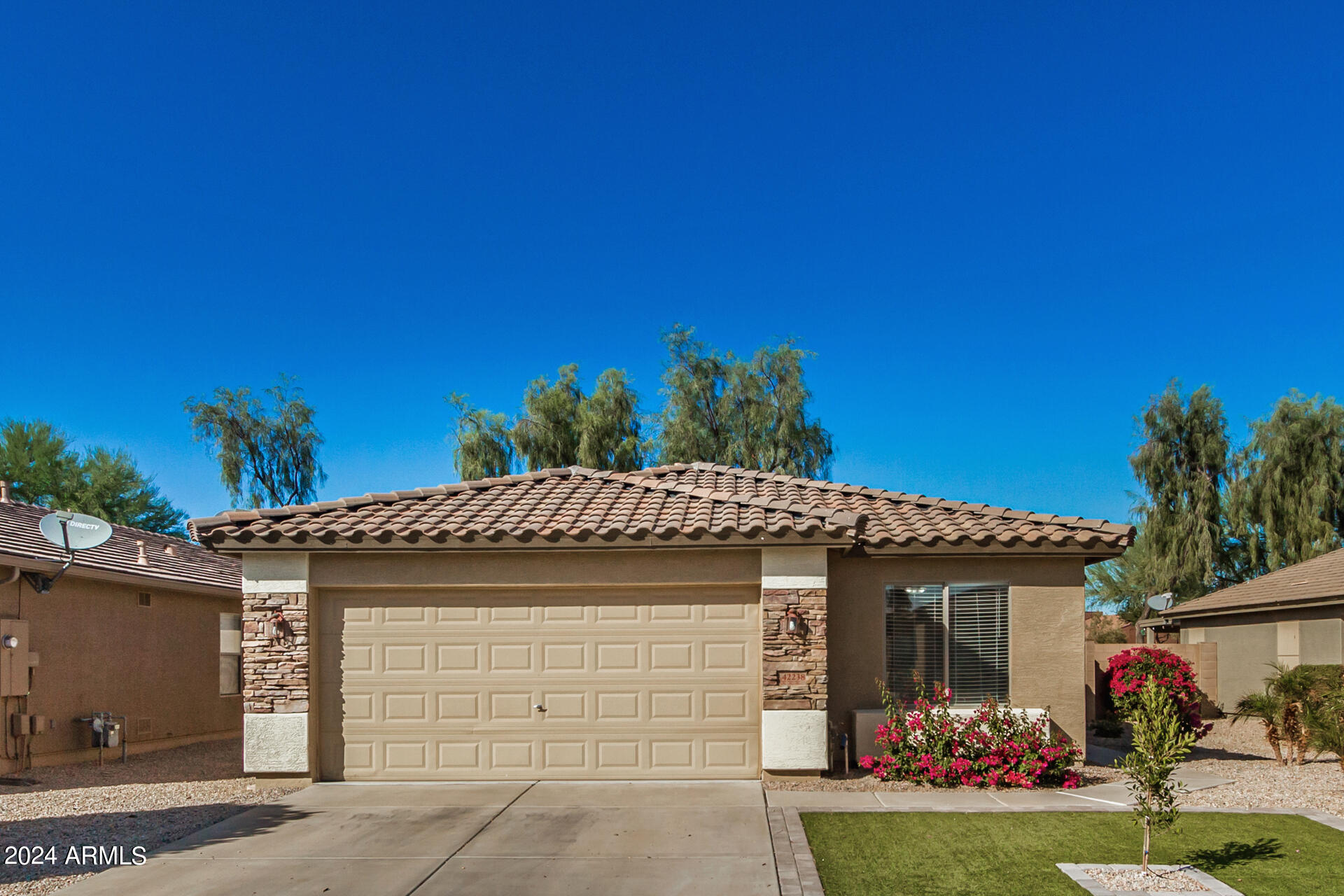 42238 West Venture Road Maricopa, AZ 85138 - Photo 1 of 33 a front view of a house with a yard