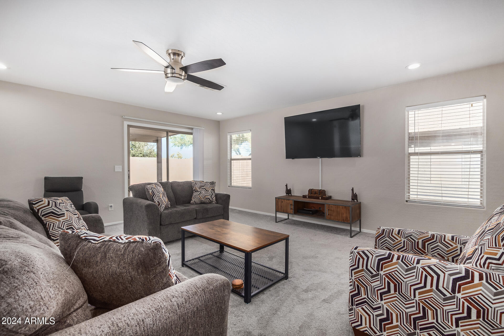 42238 West Venture Road Maricopa, AZ 85138 - Photo 8 of 33 a living room with furniture and a flat screen tv