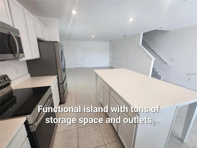 a view of a kitchen with utility area