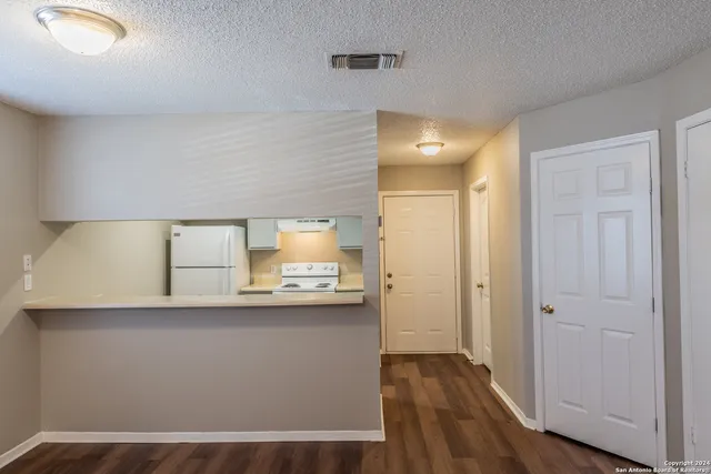 a kitchen with stainless steel appliances a sink and a refrigerator