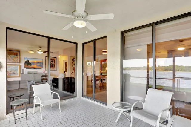 a view of a livingroom with furniture and windows