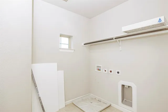 a bathroom with a shower and a sink