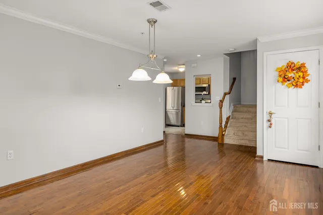 a view of a livingroom with wooden floor