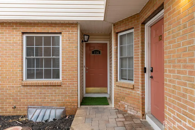 a view of a door and a window