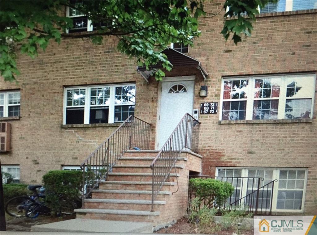 a front view of a house with large windows