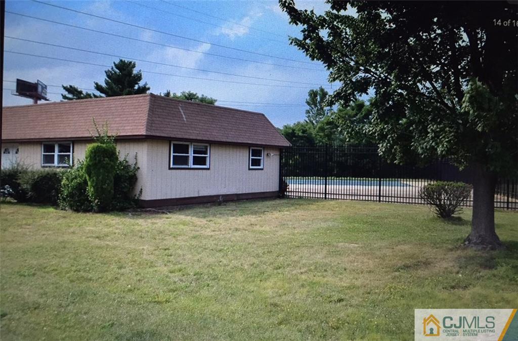 71 College Drive Edison, NJ 08817 - Photo 12 of 12 a backyard of a house with lots of green space