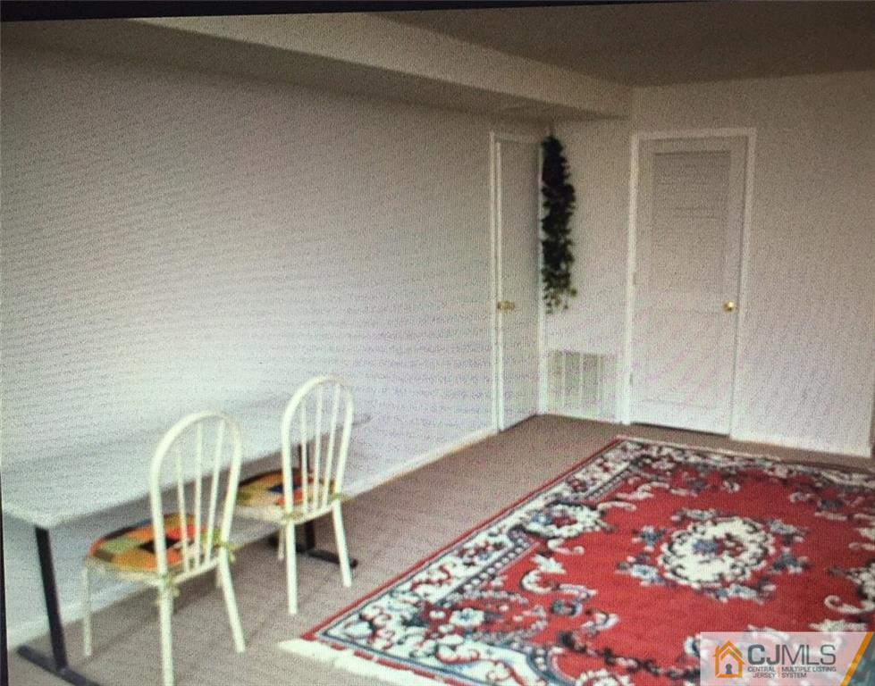 71 College Drive Edison, NJ 08817 - Photo 8 of 12 a view of a workspace with furniture and wooden floor