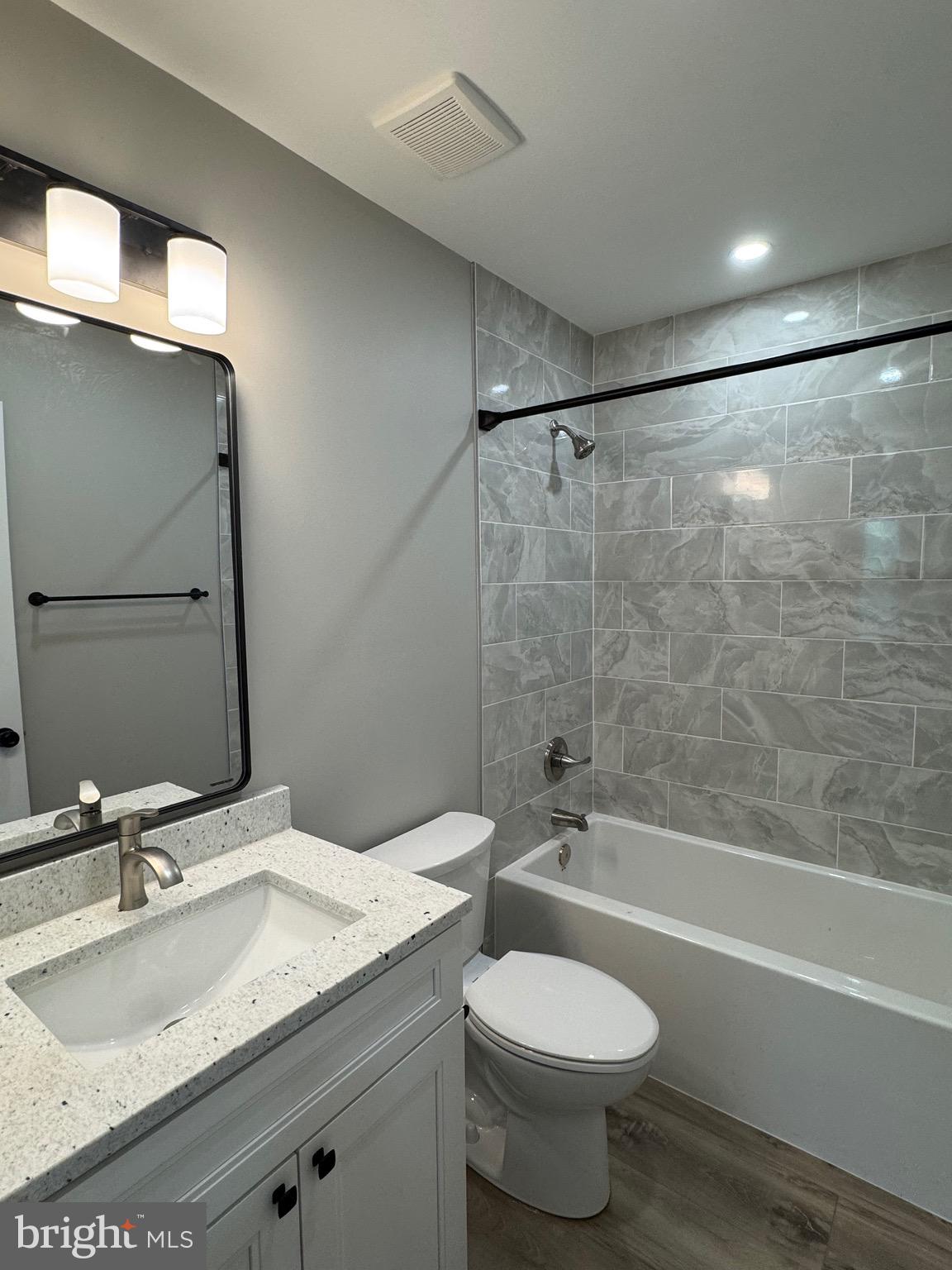 3706 South Mountain Road Knoxville, MD 21758 - Photo 11 of 12 a bathroom with a granite countertop sink toilet and shower