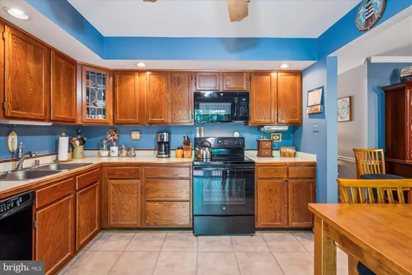 a bathroom with a sink vanity mirror and toilet