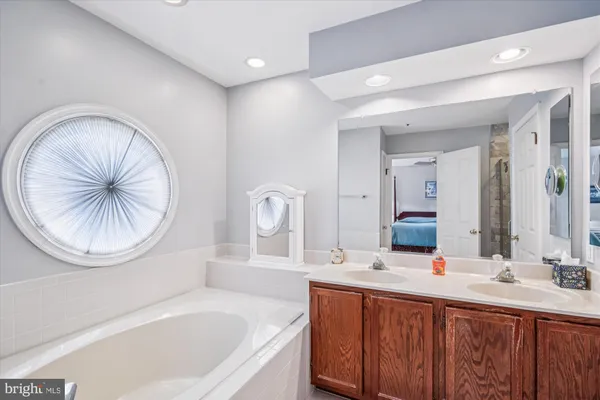 a livingroom with a fireplace and workspace