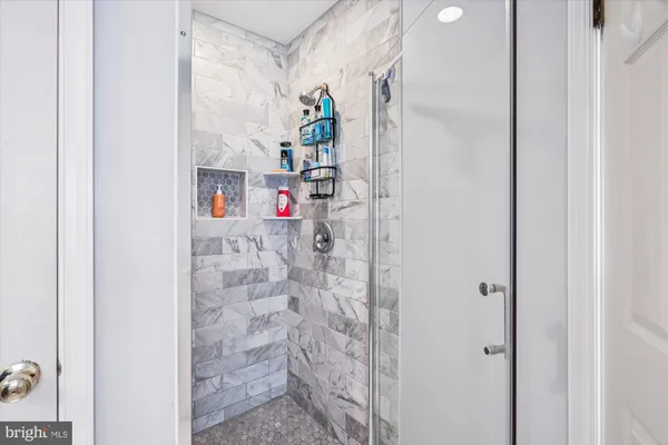 a view of a livingroom with furniture and a fireplace