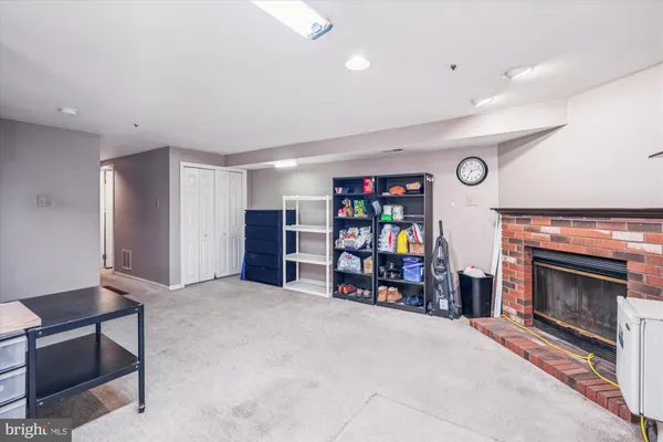 a patio with a table and chairs under an umbrella