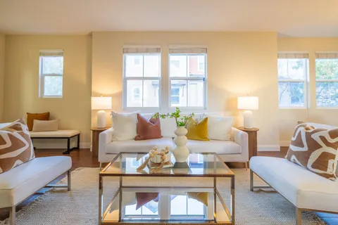 a living room with furniture and a table