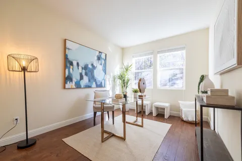 a bathroom with a sink mirror and toilet