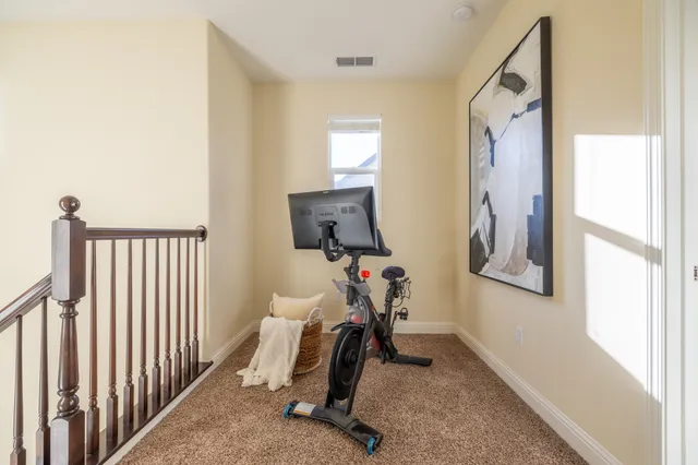 a spacious bedroom with a bed couch and a window