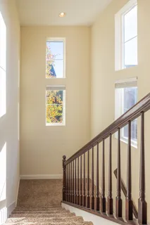 a spacious bedroom with a bed couch and a window