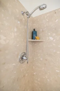 a bedroom with a bed and a mirror