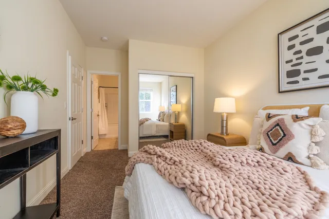 a view of a house with trees and entryway